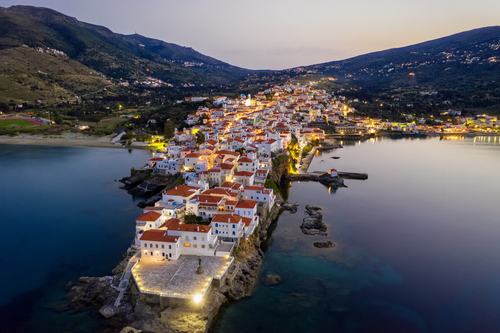 Aerial,View,Over,The,Beautiful,Illuminated,Town,Of,Andros,Island,