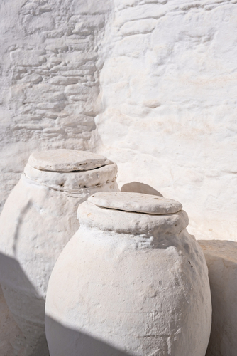 Ceramic,Pots,,Greek,Pithari,Covered,With,Stone,Painted,White,Outdoors