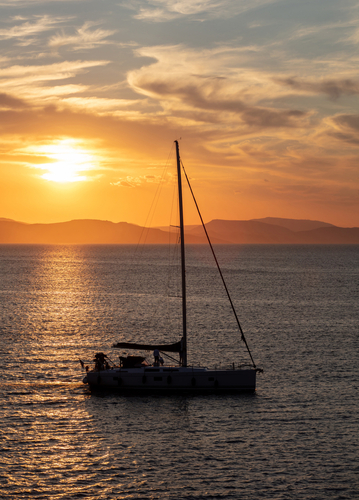 Sailing,At,Sunset,In,The,Aegean,Sea,,Greece.,Sailboat,On