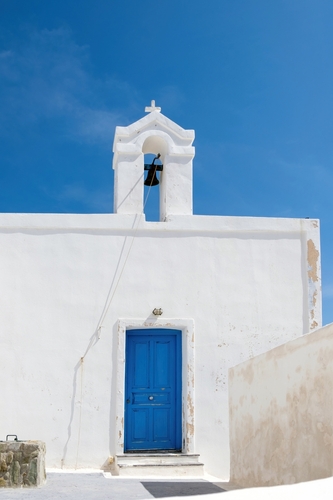 Cyclades,,Greece.,Small,White,Church,And,Belfry,Against,Blue,Sky,