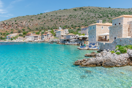View,Of,Limeni,Village,With,Fishing,Boats,In,Turquoise,Waters