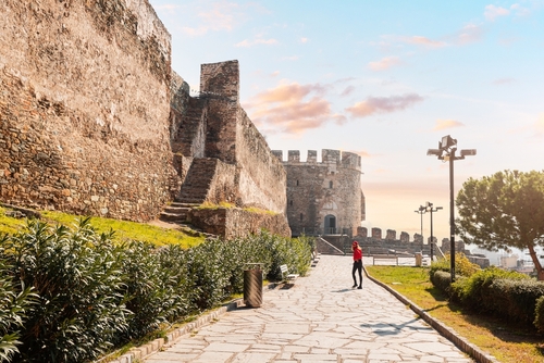 Tourist,Girl,Visitor,Walks,To,The,Entrance,Of,The,Trigonion