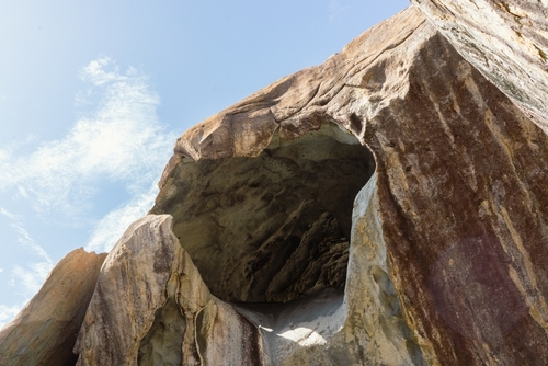 Beautiful,Cave,Rocks,With,Bright,Blue,Sky